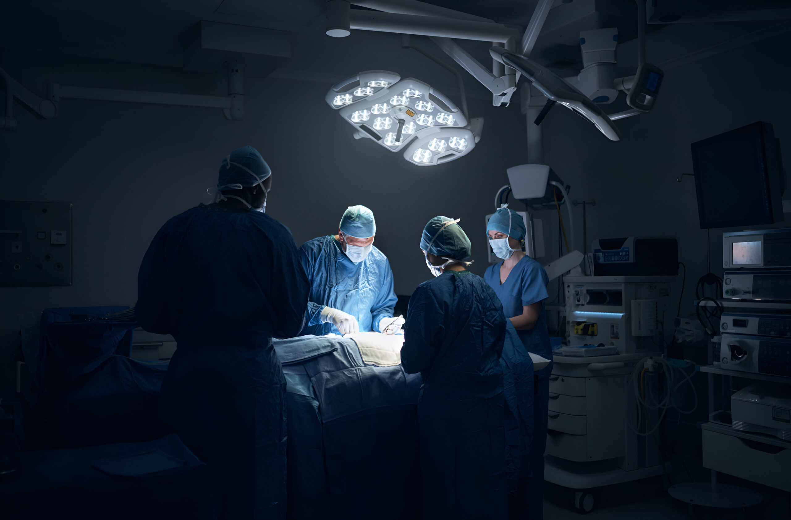 three surgeons hospital room one which is being prepared perform surgery