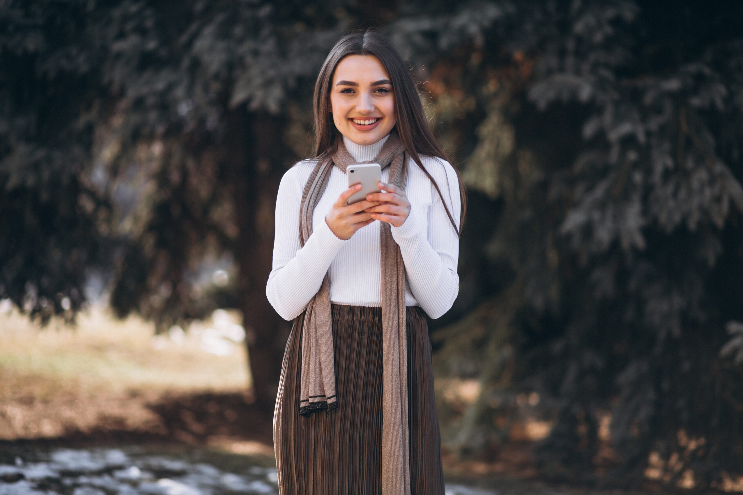 woman using phone outside the street
